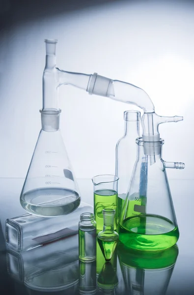 Laboratory glassware over white — Stock Photo, Image