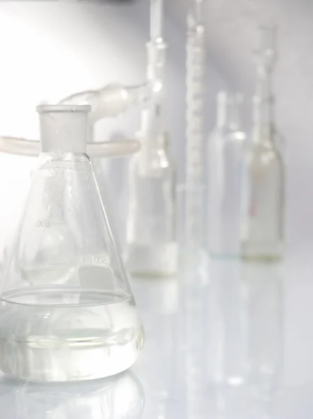 Laboratory glassware over white — Stock Photo, Image