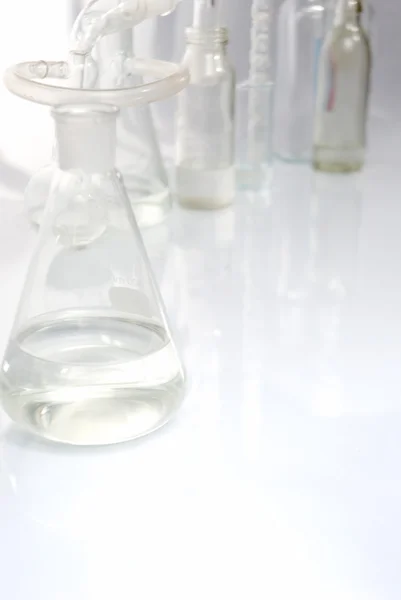 Laboratory glassware over white — Stock Photo, Image