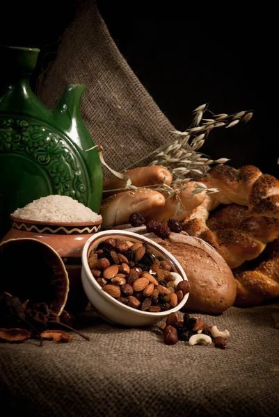 Assortment of baked bread on sacking — Stock Photo, Image