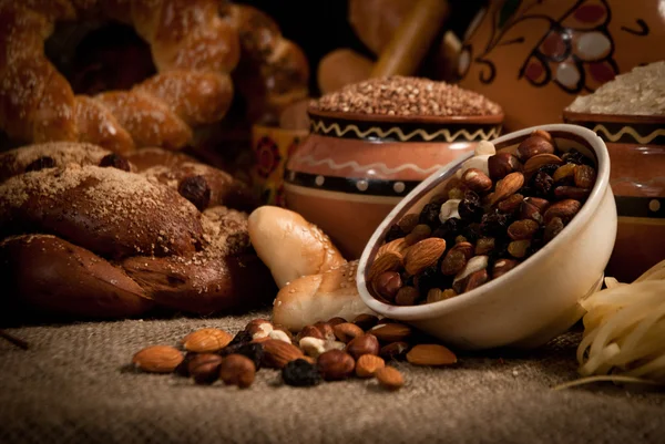 Assortment of baked bread on sacking — Stock Photo, Image