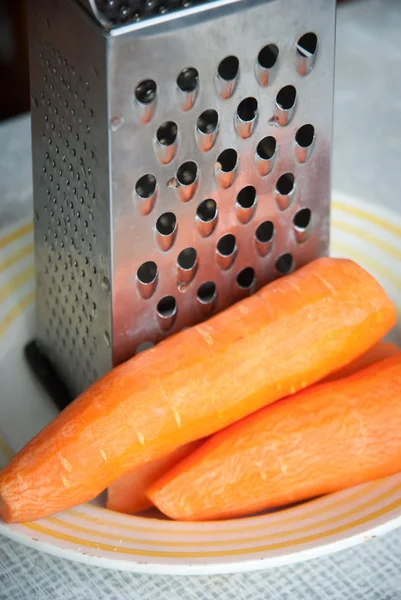 Carrot and grater for vegetables — Stock Photo, Image