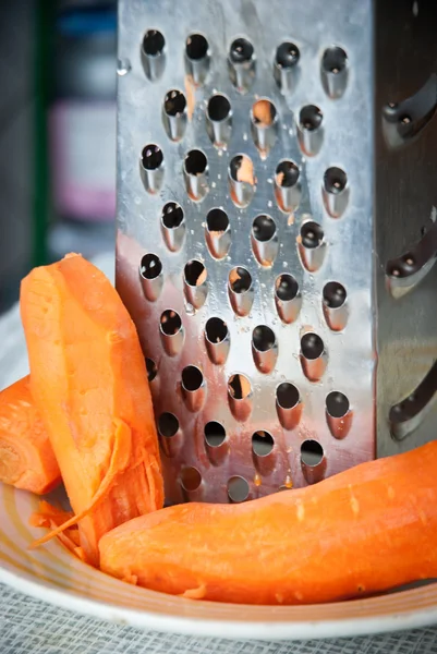 Carrot and grater for vegetables — Stock Photo, Image