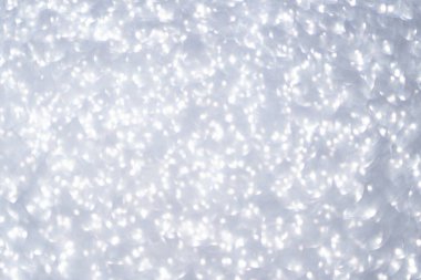 Gümüş parıltılı arka planlı Bokeh dairesi. Gri simli arka plan. Tek Renkli