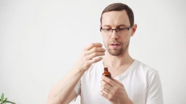 Young man hair treatment. Argan oil healthy massage. Morning bathroom routine