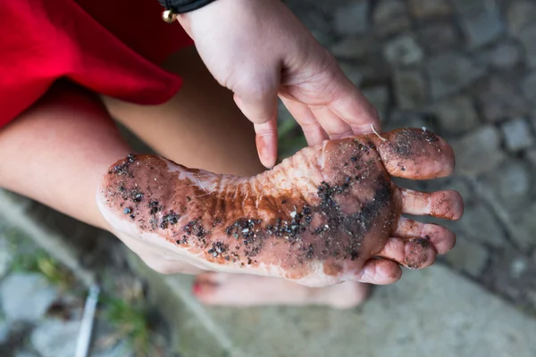 Woman with dirty feet Royalty Free Stock Photos