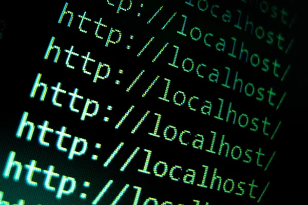 テキスト エディターで、黒の背景の localhost の url — ストック写真