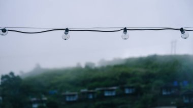 The fog floats on the mountain in the rainy season