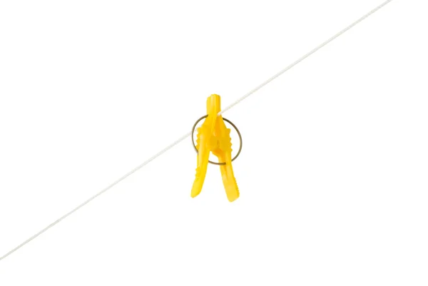 Yellow clothespin dryer hanging on a rope — Stock Photo, Image