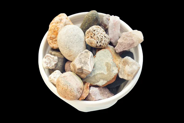 Μια στοίβα πέτρες σε ένα λευκό δοχείο. — Φωτογραφία Αρχείου