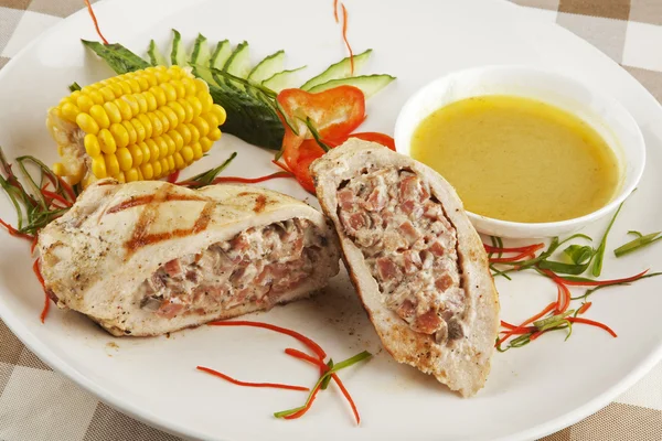 A delicious Stuffed Chicken Kiev served with corn — Stock Photo, Image