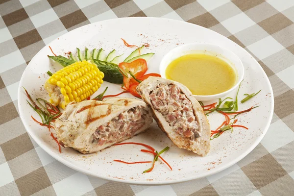 A delicious Stuffed Chicken Kiev served with corn with clipping path. — Stock Photo, Image