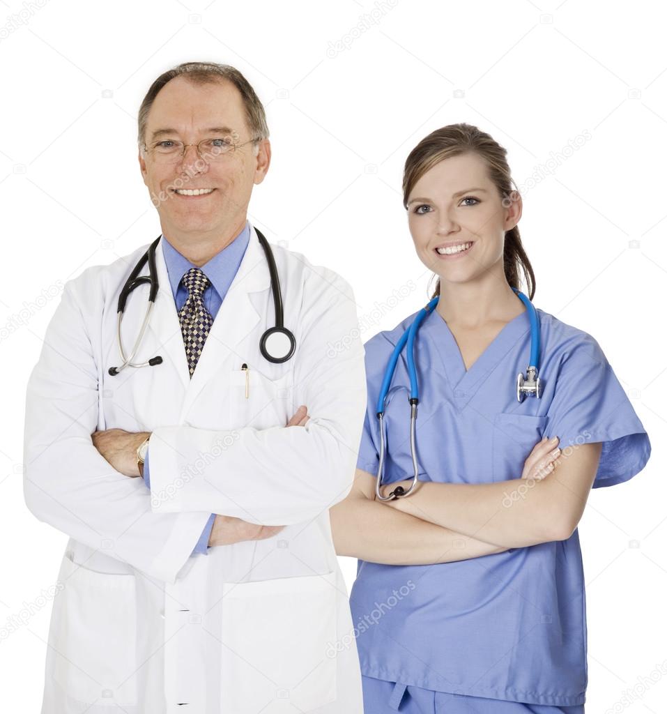 A group of confident doctors and nurses with their arms crossed displaying some attitude and smiling isolated on a white background