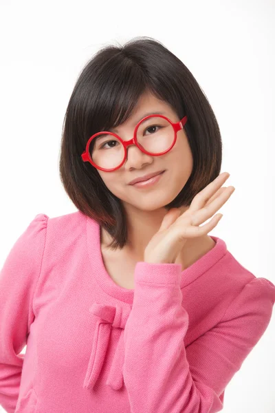 Hermosa mujer asiática mostrando un poco de actitud aislada sobre un fondo blanco — Foto de Stock