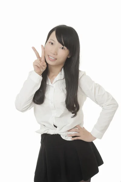 Hermosa mujer asiática mostrando alguna actitud aislada sobre un fondo blanco — Foto de Stock