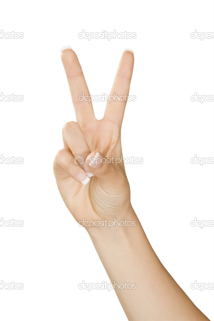 Caucasian female using hand gestures to say peace or victory isolated on a white background with a clipping path