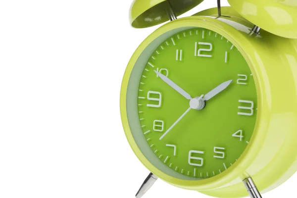 Green alarm clock with the hands at 10 and 2 isolated on a white background — Stock Photo, Image