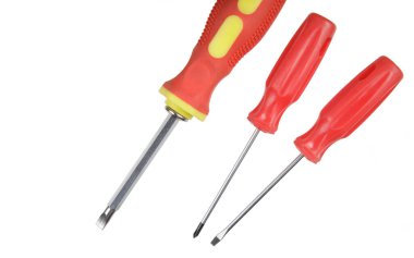 Flat Lay of a close up of screwdrivers and screws isolated on white background