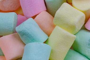 Renkli pastel şekerlemelerin arka planını kapat