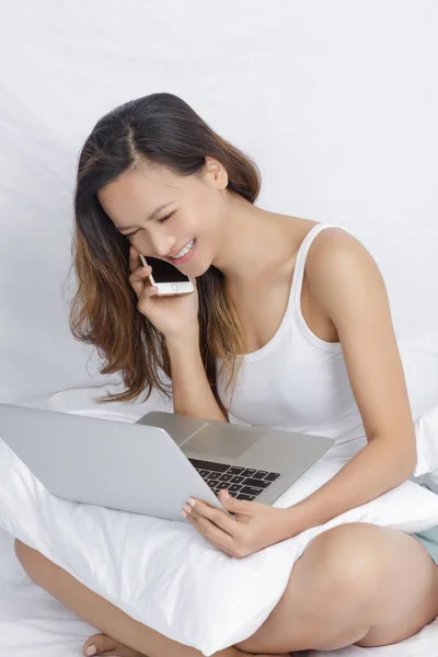 Asian Woman Working Computer Bed Isolated White — Stock Photo, Image