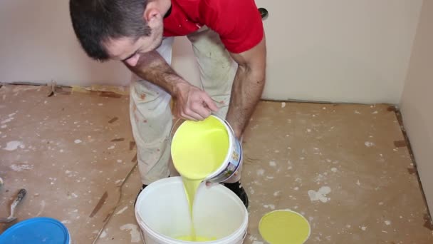 Painter Pouring Yellow Paint - Montage — Stock Footage Painter Pouring Yellow Paint - Montage Stock Video