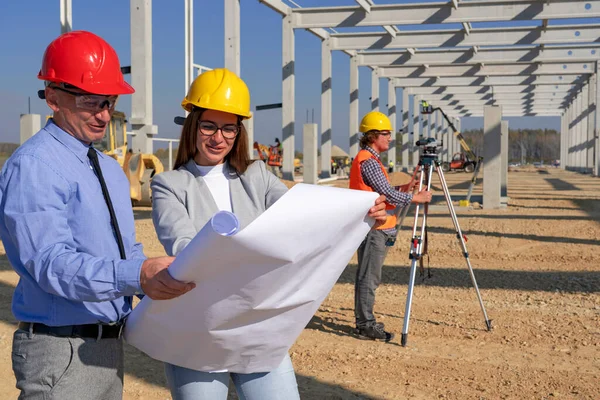 Construction Manager Young Female Architect Checking Blueprint Construction Site Man — Stock Photo, Image