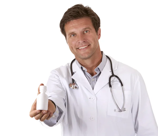 Doctor holding pills — Stock Photo, Image