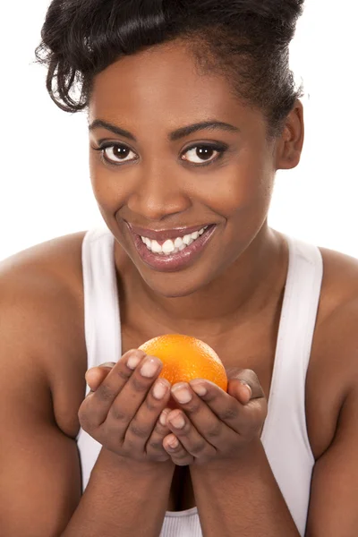 Woman with an orange — Stock Photo, Image