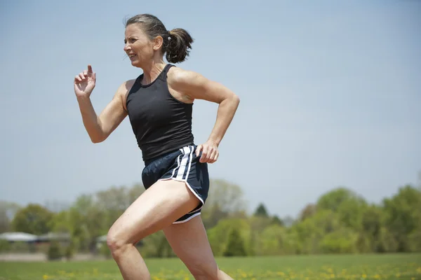 Mature woman running — Stock Photo, Image