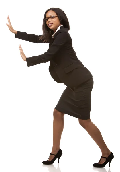 Business woman pushing invisible object — Stock Photo, Image