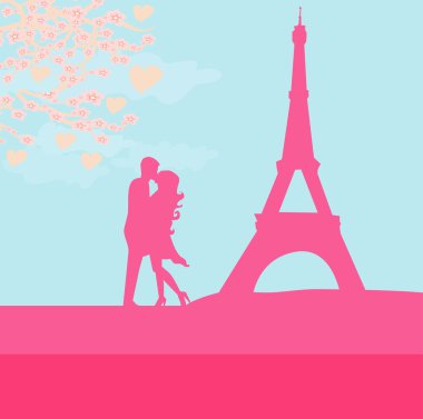 Paris 'te Eyfel Kulesi' nin yakınında öpüşen romantik bir çift.