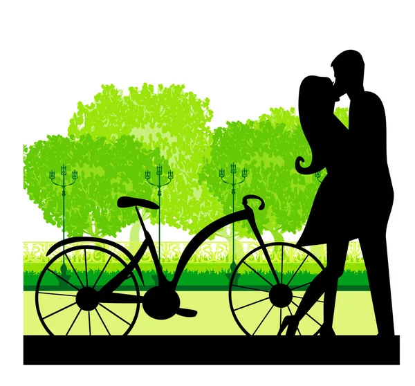 Sillhouette of sweet young couple in love standing in the park — Stock Vector