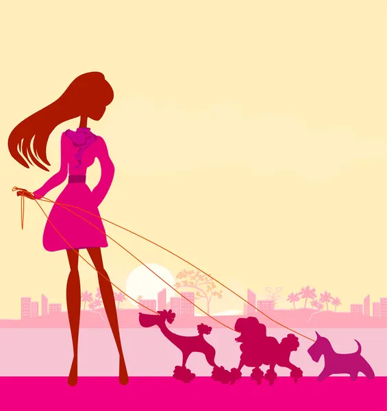 Güzel kız köpekleri gezdiriyor.