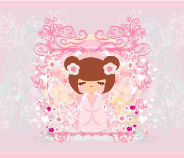 Pembe arka planda çiçekli Kokeshi bebeği.