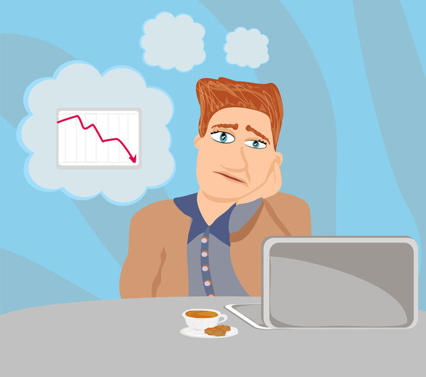 грустный и вдумчивый бизнесмен сидит и пользуется ноутбуком