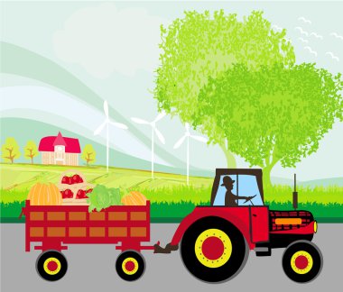 Sebze dolu bir treylerle traktör süren bir adam.