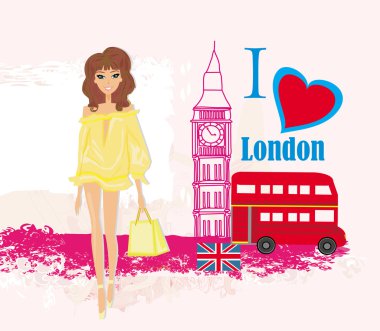 Londra 'da güzel bir kadın, üzerinde Londra' nın simgeleri olan soyut bir kart.