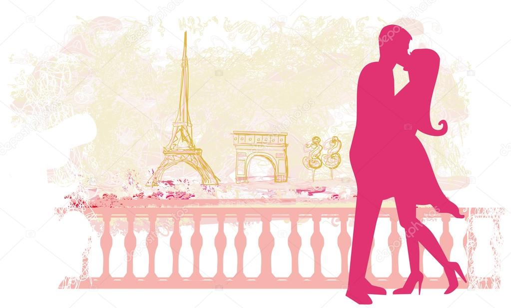 Romantic couple silhouette in Paris kissing near the Eiffel Towe