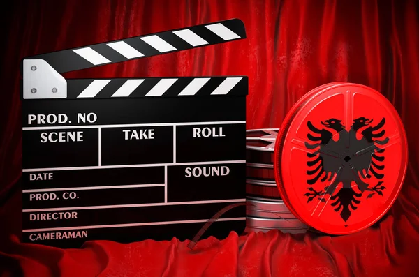 Albanian cinematography, film industry, cinema in Albania, concept. Clapperboard with and film reels on the red fabric, 3D rendering