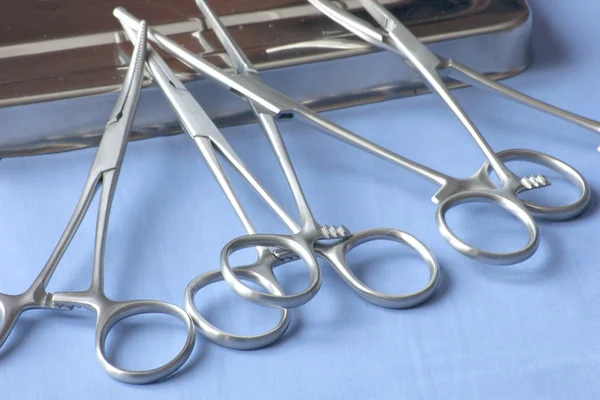 Surgical forceps suppored on the see vendors — Stock Photo, Image