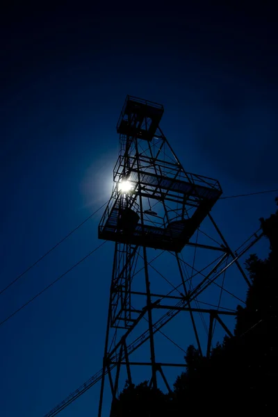 Oil well tower at sunset — Stock Photo, Image