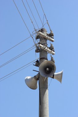Telegraph pole with speakers clipart