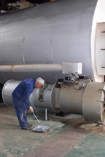 Painting a large steam boiler — Stock Photo, Image