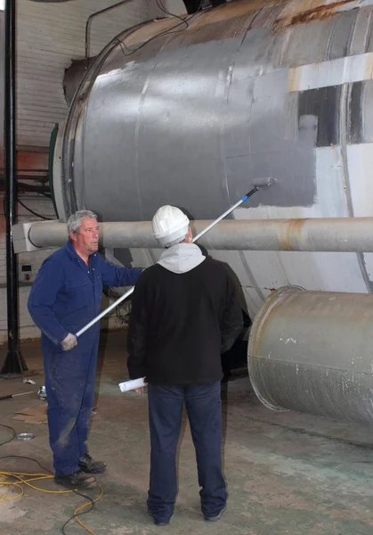 Painting a large steam boiler — Stock Photo, Image