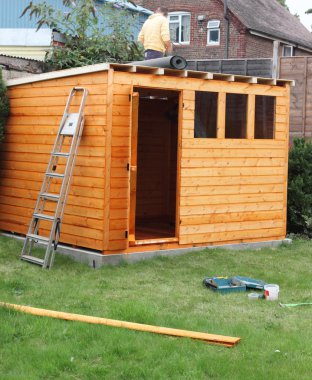 Building a wooden shed clipart