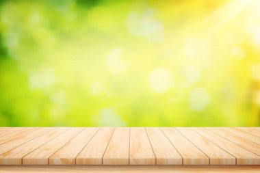 Boyalı Çizim Vektörü Ahşap masa tabanı ve güzel yeşil yaprak soyut bulanık bokeh ışık arka planı.