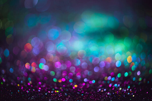 bokeh effect glitter colorful blurred abstract background for birthday, anniversary, wedding, new year eve or Christmas.