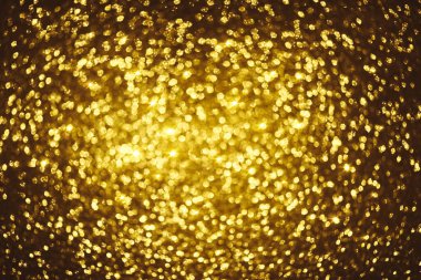 Altın parıltılı bokeh aydınlatma dokusu doğum günü, yıldönümü, düğün, yeni yıl arifesi veya Noel için soyut arkaplanı bulanıklaştırdı