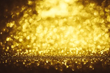Altın parıltılı bokeh aydınlatma dokusu doğum günü, yıldönümü, düğün, yeni yıl arifesi veya Noel için soyut arkaplanı bulanıklaştırdı