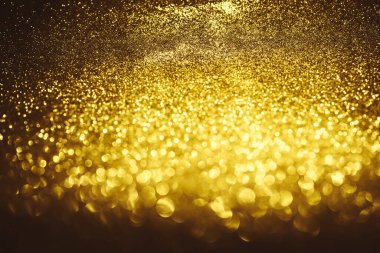 Altın parıltılı bokeh aydınlatma dokusu doğum günü, yıldönümü, düğün, yeni yıl arifesi veya Noel için soyut arkaplanı bulanıklaştırdı